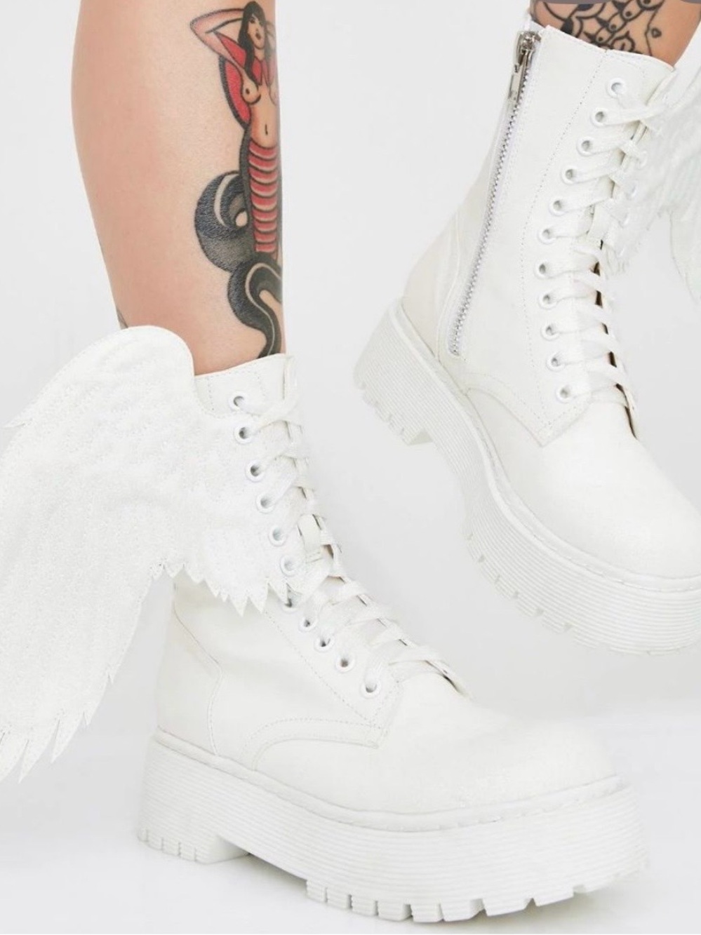 White boots are the "Such A Cherub" combat boots from the brand Dolls Kill